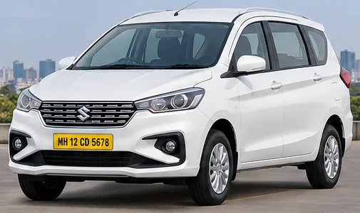 White Ertiga outstation taxi from Mumbai with yellow MH number plate